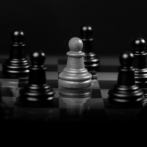 The Branding Company branding visual in black and white, featuring a standout white pawn on a chessboard to represent strong brand positioning.
